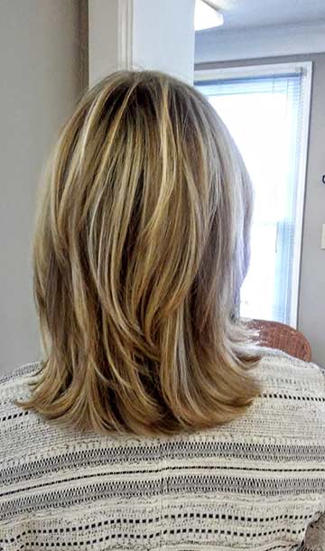 beautiful high and low lights in a modern, modified shag cut
